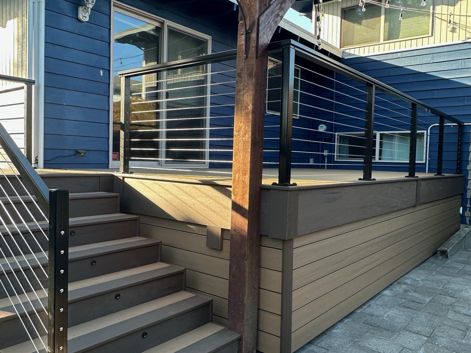 After: Old wood deck and stairs rebuilt with composite decking, cable railing and a cedar pergola