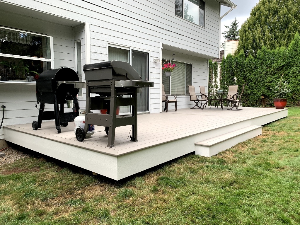 Low white composite platform deck with grills off the back door