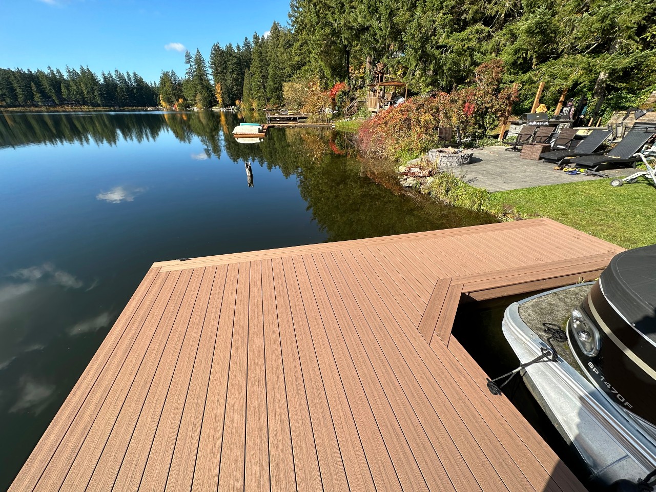 Composite dock with boat lift on a calm lake