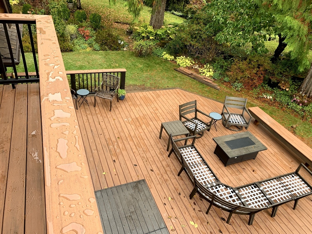 Large composite deck with a fire pit seating area seen from above