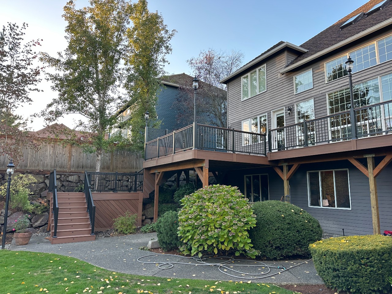 Two-story deck with timber posts and stairs to the yard